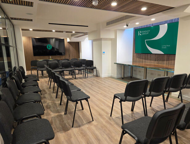 Conference room at Camden Gateway set out with rows of chairs and a screen