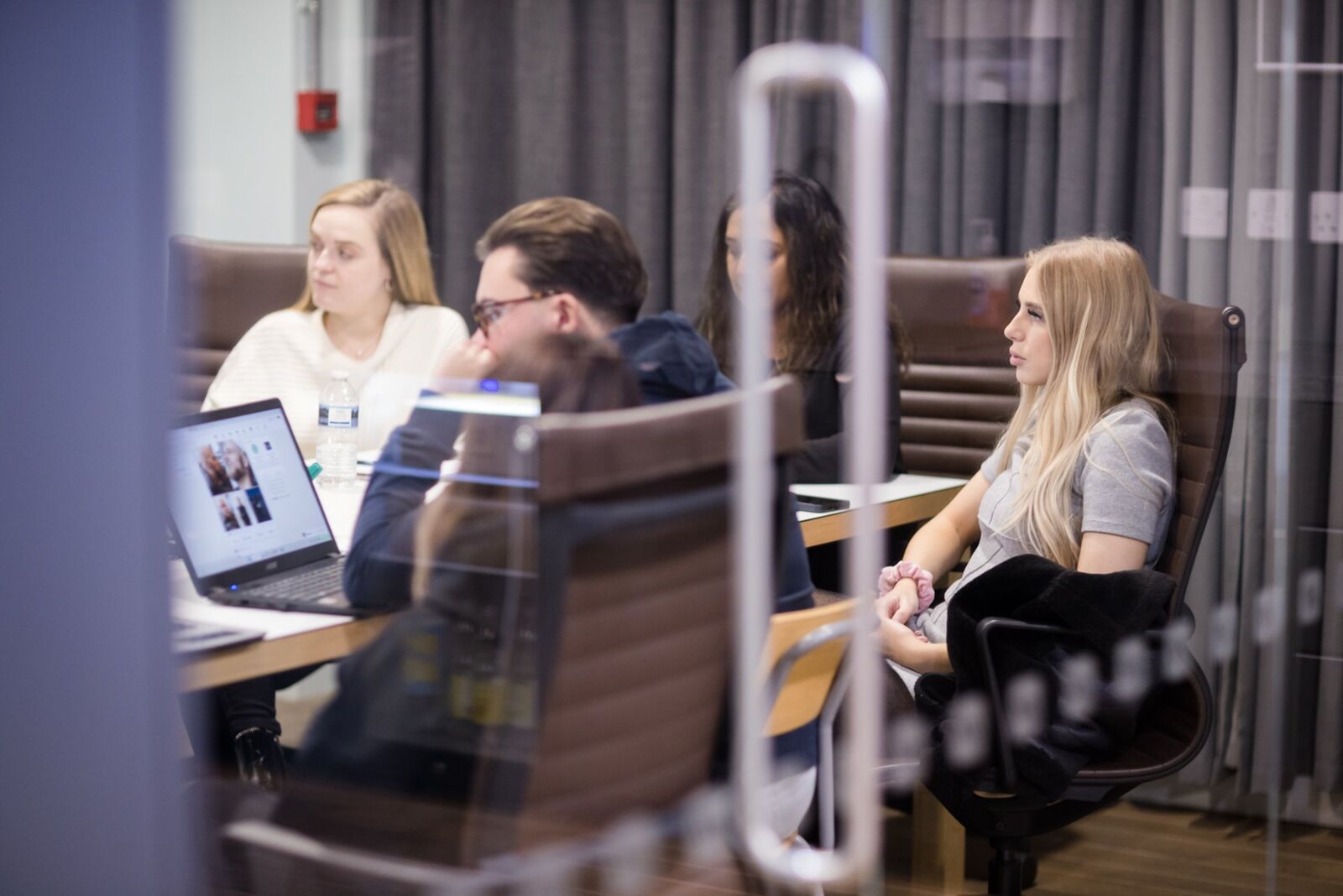 Group of people sitting in a conference room during a meeting