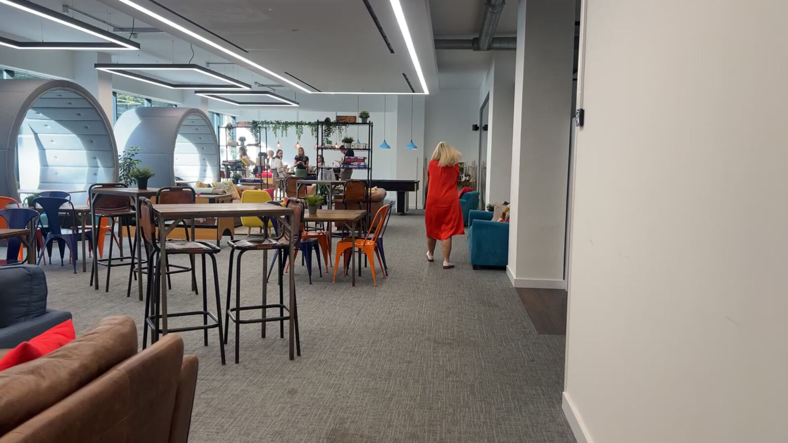 Ground-floor community space at TBXH @ Sunley House, Croydon, with high tables and sofas