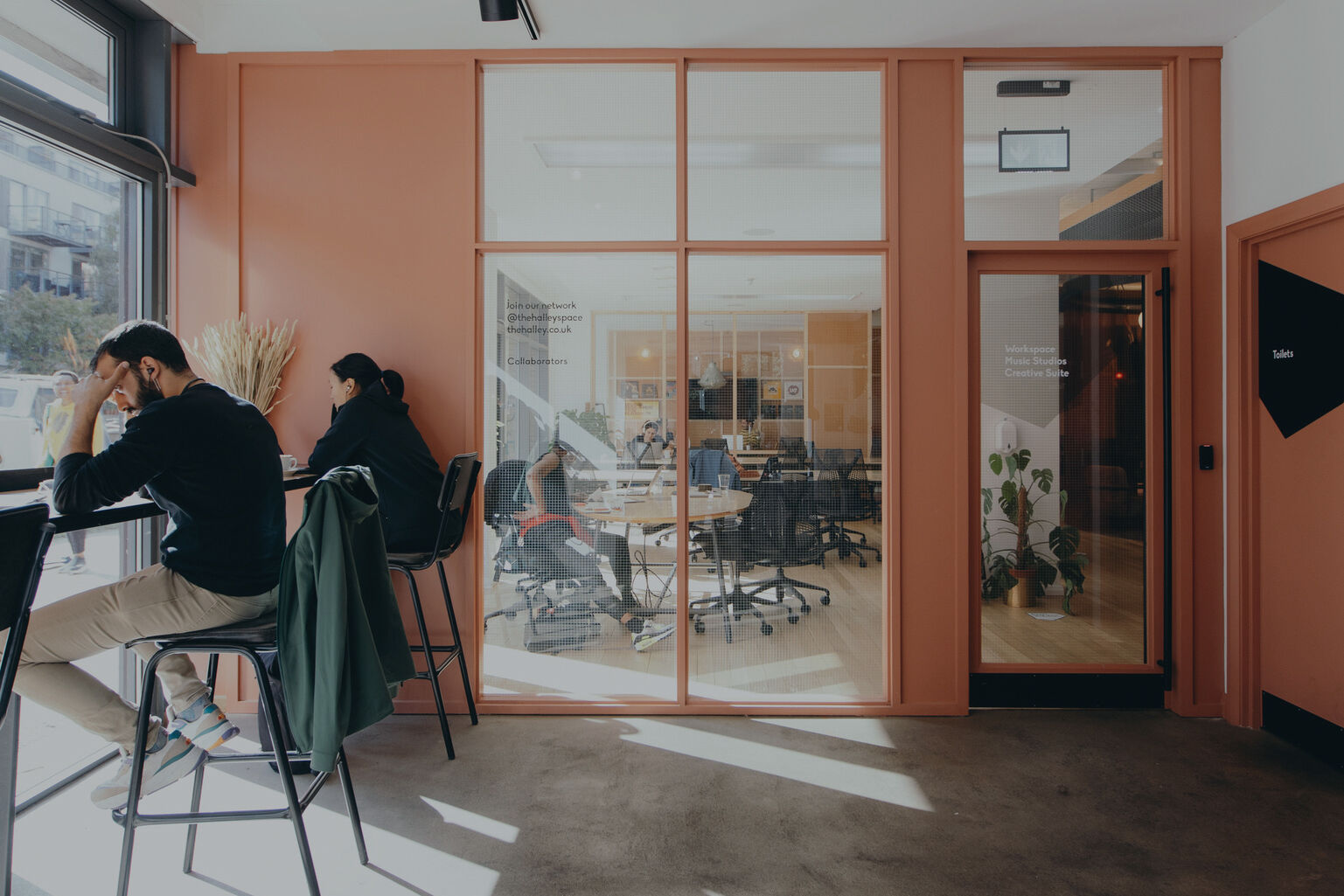 Window bench seating and glazed meeting room in The Halley's workspace